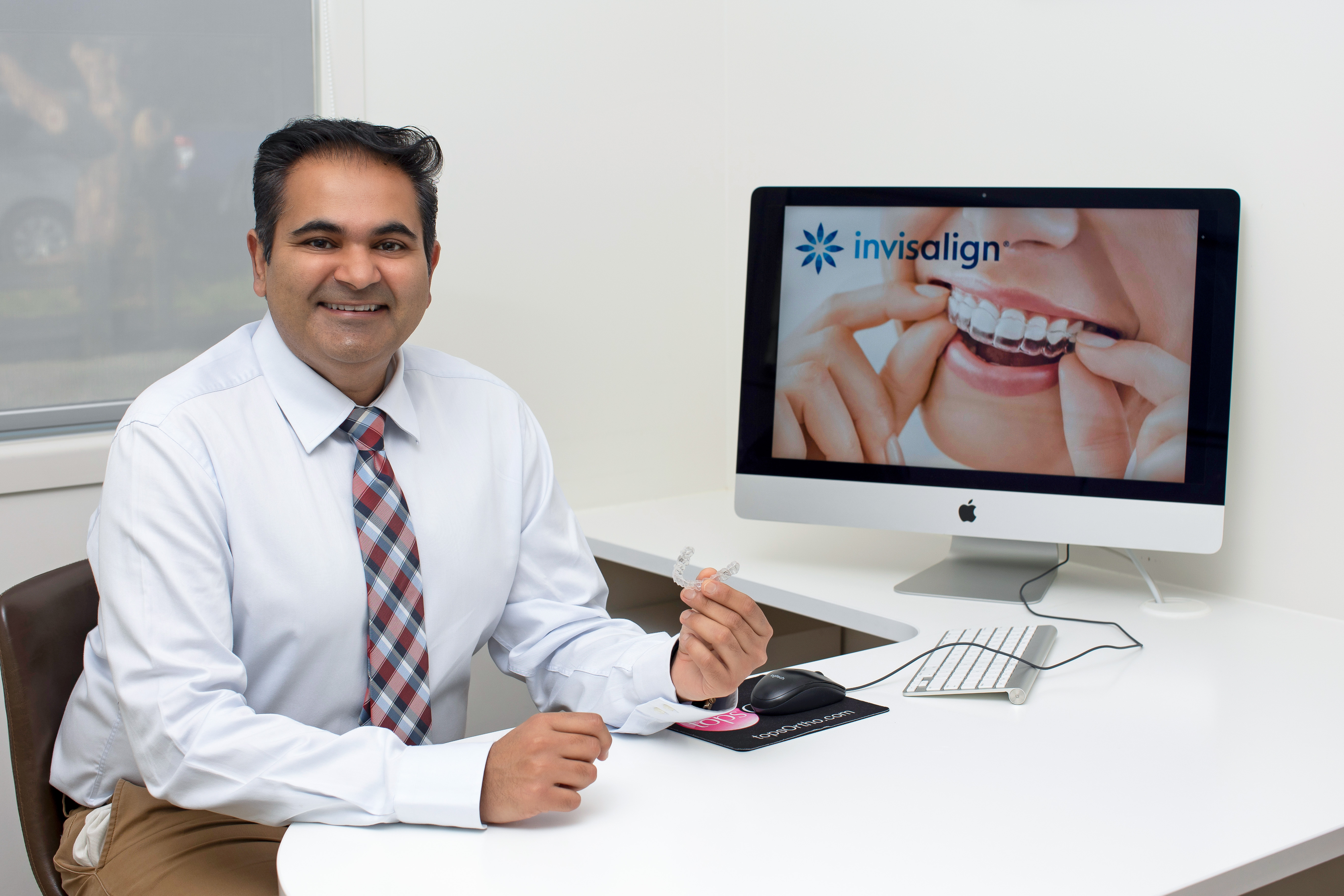 Dr Raniga with Invisalign Dr Raniga with Invisalign
